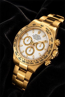 Luxury watch series showing four expensive watches ranging from approximately forty-nine thousand dollars to sixty thousand dollars.