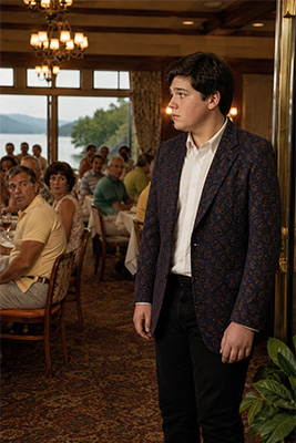 Fifteen-year-old young man realizing he is overdressed in a casual Lake George hotel dining room.
